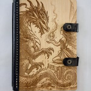 The Pact of Ember and Wing engraved wooden notebook cover