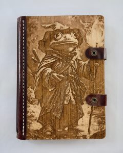 Toadrick the Traveler engraved wood notebook cover